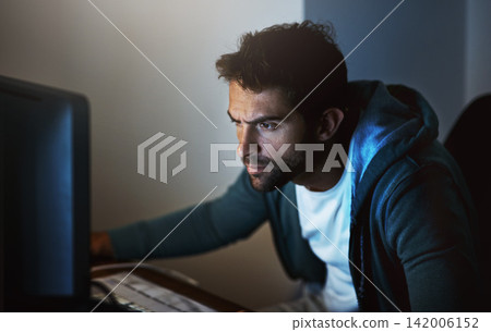 Computer, man or hacker at night for cyber security, coding, software and programming malware. Technology, male person or developer in home office for phishing, ransomware and digital crimes Computer, man or hacker at night for cyber security, coding, software and programming malware. Technology, male person or developer in home office for phishing, ransomware and digital crimes 142006152