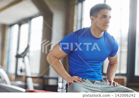 Fitness, health and happy man with water after training for bodybuilder competition. Sport, exercise and male athlete in portrait with smile and drink for energy to practice weight lifting at gym Fitness, health and happy man with water after training for bodybuilder competition. Sport, exercise and male athlete in portrait with smile and drink for energy to practice weight lifting at gym 142006242