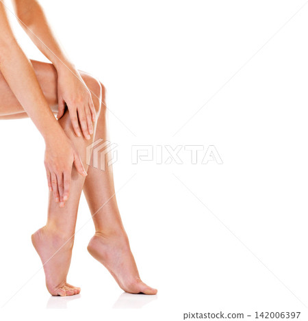 Woman, legs and body care in studio, smooth and skincare for grooming skin on white background. Female person, mockup space and cosmetics treatment or hair removal, epilation and feet for hygiene Woman, legs and body care in studio, smooth and skincare for grooming skin on white background. Female person, mockup space and cosmetics treatment or hair removal, epilation and feet for hygiene 142006397