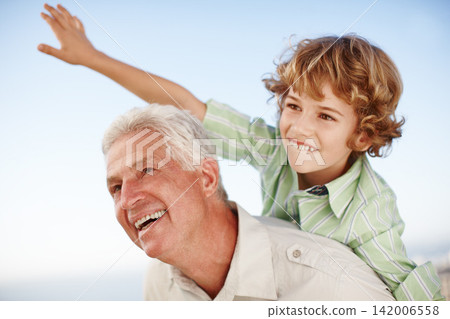 Happy, blue sky and child playing with grandfather for bonding, relationship and relax together outdoors. Family, nature and grandpa with young boy on summer holiday, vacation and weekend at park Happy, blue sky and child playing with grandfather for bonding, relationship and relax together outdoors. Family, nature and grandpa with young boy on summer holiday, vacation and weekend at park 142006558