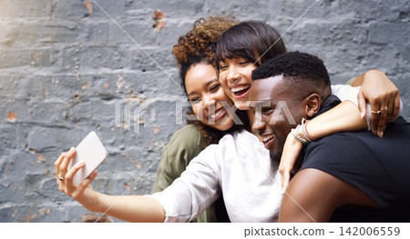 Selfie, social media and smile with friends on brick wall background for profile picture update. App, energy or excitement with happy man and woman group in city for mobile or online photography Selfie, social media and smile with friends on brick wall background for profile picture update. App, energy or excitement with happy man and woman group in city for mobile or online photography 142006559