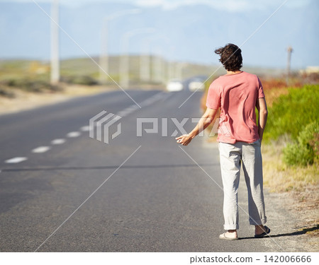 Man, highway and hiking for getaway outside for road trip, vacation and adventure for travel. Male person, walking and vehicle problems outside for vacation, thumbs up and long journey on roadside. Man, highway and hiking for getaway outside for road trip, vacation and adventure for travel. Male person, walking and vehicle problems outside for vacation, thumbs up and long journey on roadside. 142006666