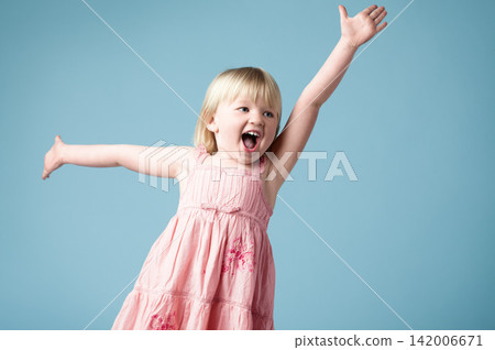 Studio, child or girl excited with dance for surprise, happy or isolated on blue background. Model, backdrop or kid for announcement with face reaction of wow, omg or shocked emoji with mind blown 142006671