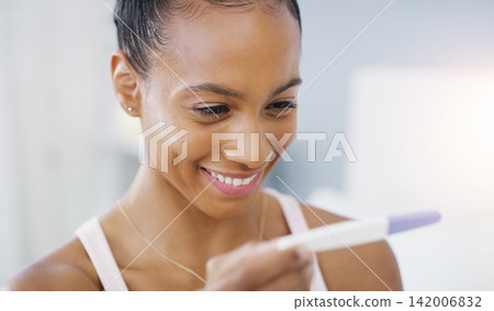 Woman, pregnancy test and smile in home for fertility journey or future mother, results or ivf. Female person, stick and kit or happiness good news with surprise in apartment, ovulation or positive Woman, pregnancy test and smile in home for fertility journey or future mother, results or ivf. Female person, stick and kit or happiness good news with surprise in apartment, ovulation or positive 142006832