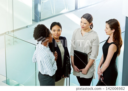 Top view, collaboration and communication in corporate meeting for finance report, diversity and strategy while brainstorming. Teamwork, business women and discuss project in office, idea or planning Top view, collaboration and communication in corporate meeting for finance report, diversity and strategy while brainstorming. Teamwork, business women and discuss project in office, idea or planning 142006982