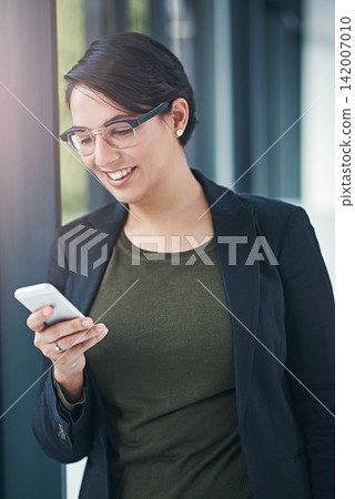 Happy woman, business and browsing with phone for social media, communication or news at office. Female person or employee with smile on mobile smartphone for online chatting or texting at workplace Happy woman, business and browsing with phone for social media, communication or news at office. Female person or employee with smile on mobile smartphone for online chatting or texting at workplace 142007010