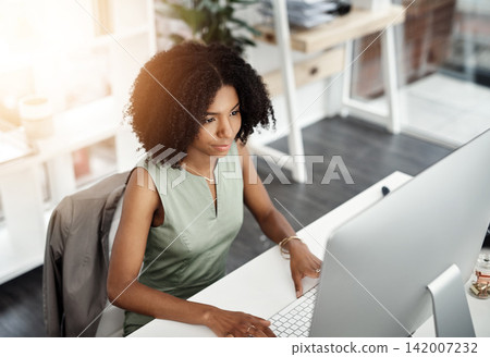 African business woman, smile and computer in office for career, online digital report and web project. Editor or young person with tech and looking at screen for typing or internet with lens flare 142007232