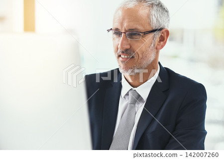 Computer, smile and mature businessman in office with glasses for web, research and b2b communication. Pc, review and CEO reading company newsletter, planning or checking email, schedule or feedback Computer, smile and mature businessman in office with glasses for web, research and b2b communication. Pc, review and CEO reading company newsletter, planning or checking email, schedule or feedback 142007260