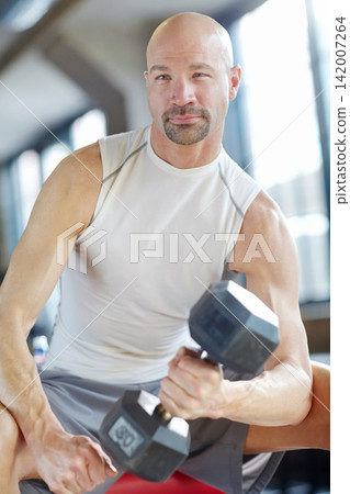Man, weight lifting and workout in gym for strength with dumbbell, fitness challenge and strong muscle. Bodybuilder, pro athlete and training for bodybuilding routine, power or exercise concentration 142007264
