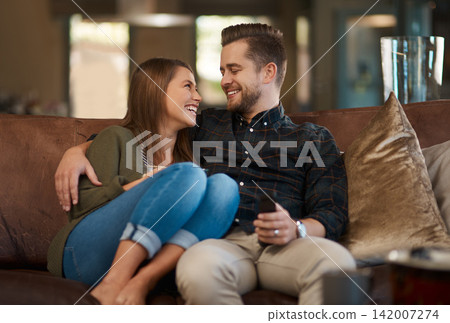 Happy couple, smile and hug on sofa for support, care and in love for relationship and dating on weekend in home. Man, woman and cheerful in house for bond, affection or loving for vacation or unwind Happy couple, smile and hug on sofa for support, care and in love for relationship and dating on weekend in home. Man, woman and cheerful in house for bond, affection or loving for vacation or unwind 142007274