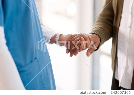 Empathy, holding hands and senior man with nurse in retirement home for support, care and healing. Kindness, sorry and homecare worker with elderly patient for trust, comfort or physiotherapy help Empathy, holding hands and senior man with nurse in retirement home for support, care and healing. Kindness, sorry and homecare worker with elderly patient for trust, comfort or physiotherapy help 142007365