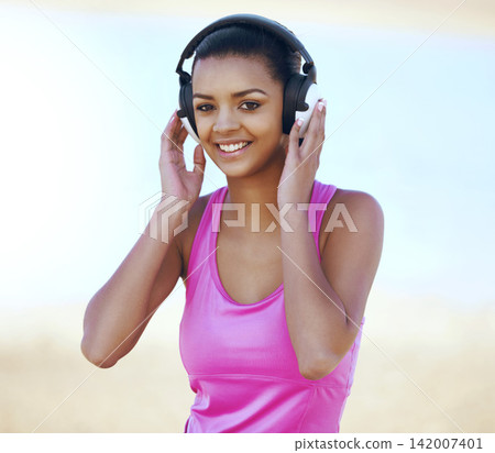 Sports, portrait and woman with headphones outdoor listening to music, podcast or radio for running. Fitness, nature and Mexican female athlete runner streaming song for cardio workout or training. 142007401