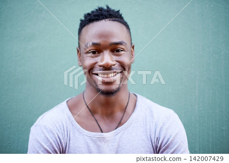 Happy, black man and wall for portrait in outdoor with relaxed facial expression for hearing good news or results. Smile, African and male student with positive attitude from Kenya by blue background Happy, black man and wall for portrait in outdoor with relaxed facial expression for hearing good news or results. Smile, African and male student with positive attitude from Kenya by blue background 142007429