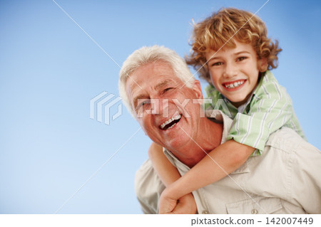 Happy, blue sky and portrait of grandpa and kid for bonding, relationship and relax together outdoors. Family mockup, nature and grandfather with boy on summer holiday, vacation and weekend at park Happy, blue sky and portrait of grandpa and kid for bonding, relationship and relax together outdoors. Family mockup, nature and grandfather with boy on summer holiday, vacation and weekend at park 142007449