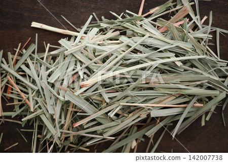 Dried Lemongrass Strips Pile. Aromatic Herbal Tea Ingredient and Natural Citrus-Scented Plant 142007738