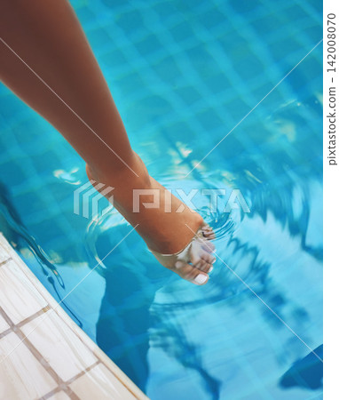 Hotel, foot and swimming in pool, luxury and holiday in summer, travel and relax for person in trip. Tourist, vacation and outdoor for water, calm and blue in color, toes and paradise in Maldives Hotel, foot and swimming in pool, luxury and holiday in summer, travel and relax for person in trip. Tourist, vacation and outdoor for water, calm and blue in color, toes and paradise in Maldives 142008070