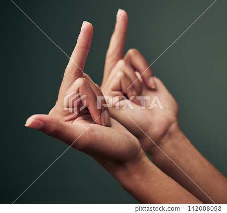 Studio, rude and hands of person with middle finger for bad review, offended or angry on green background. Conflict, sign language and emoji with gesture for rejection, fake news and negative opinion Studio, rude and hands of person with middle finger for bad review, offended or angry on green background. Conflict, sign language and emoji with gesture for rejection, fake news and negative opinion 142008098