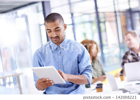 Man, working and tablet in business office, web designer and creative career or online networking for research. Internet, company and coworking workplace, reading and reviews for project or employee Man, working and tablet in business office, web designer and creative career or online networking for research. Internet, company and coworking workplace, reading and reviews for project or employee 142008221
