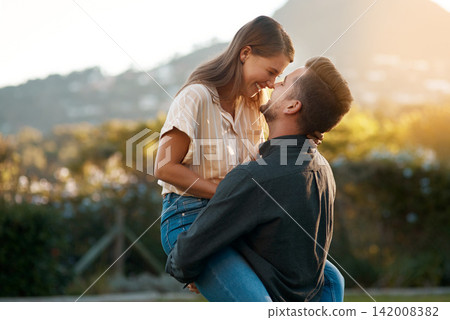 Man, woman and carry with laughing in park for marriage anniversary or funny joke, love or romance. Happy couple, pick up and embrace in backyard for partnership travel on date, vacation or summer Man, woman and carry with laughing in park for marriage anniversary or funny joke, love or romance. Happy couple, pick up and embrace in backyard for partnership travel on date, vacation or summer 142008382