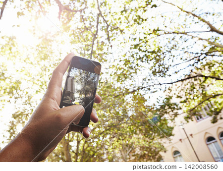 Phone, screen and photography of trees in park at college, campus or academy building with nature. Outdoor, filming and hand click recording on cellphone to post online about environment at school Phone, screen and photography of trees in park at college, campus or academy building with nature. Outdoor, filming and hand click recording on cellphone to post online about environment at school 142008560