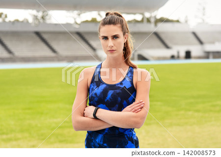 Athlete, fitness and portrait in stadium for sport, wellness and game challenge for workout and exercise. Young lady or serious player and confident on grass for athletic or training outdoor on field 142008573