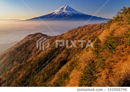 Mount Fuji as seen in the early morning from just below the summit of Mitsutoge Mountain. Mount Fuji as seen in the early morning from just below the summit of Mitsutoge Mountain. 142008740