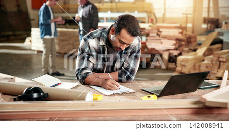 Man, carpenter and writing at warehouse with clipboard, stock and timber price for production. Person, laptop and checklist at workshop for carpentry, quotation and order for manufacturing furniture Man, carpenter and writing at warehouse with clipboard, stock and timber price for production. Person, laptop and checklist at workshop for carpentry, quotation and order for manufacturing furniture 142008941