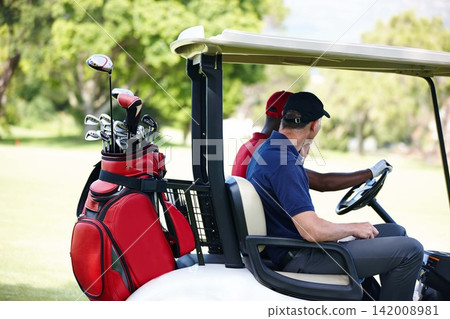 Men, golf cart and driving on lawn for workout with sunshine, sportswear and exercise. Male golfers, sport and transportation outside for entertainment with green nature, health and training together Men, golf cart and driving on lawn for workout with sunshine, sportswear and exercise. Male golfers, sport and transportation outside for entertainment with green nature, health and training together 142008981
