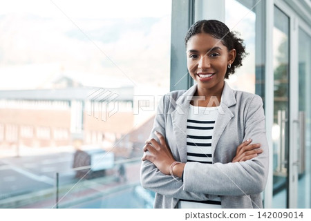 Crossed arms, office and portrait of business black woman with confidence, company pride and startup ideas. Professional, window and person in workplace for career, job and working in creative agency Crossed arms, office and portrait of business black woman with confidence, company pride and startup ideas. Professional, window and person in workplace for career, job and working in creative agency 142009014
