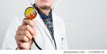 Bhutan healthcare system, Bhutanese national healthcare concept. Hand of doctor holding stethoscope Bhutan healthcare system, Bhutanese national healthcare concept. Hand of doctor holding stethoscope 142009110