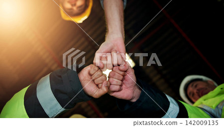 Hands, fist bump and engineer with people in warehouse for solidarity, architecture and meeting. Construction, mission and low angle of employees in factory for property development and achievement Hands, fist bump and engineer with people in warehouse for solidarity, architecture and meeting. Construction, mission and low angle of employees in factory for property development and achievement 142009135