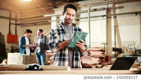Carpenter, online and man with tablet in factory, review or research for furniture design on website. Manufacturing, workshop and person with technology, info and planning for woodworking project Carpenter, online and man with tablet in factory, review or research for furniture design on website. Manufacturing, workshop and person with technology, info and planning for woodworking project 142009137