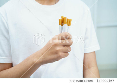 Man holding cigarette, no smoking. Man holding cigarette, no smoking. 142009167