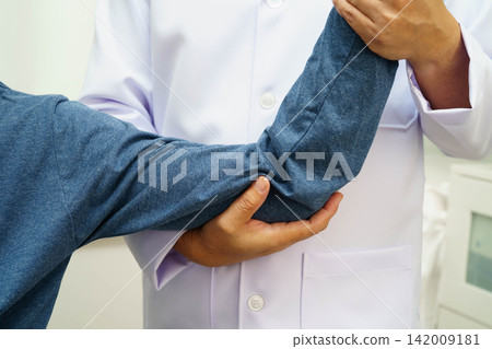 Physical therapy, Asian therapist doctor treat perform pain therapy in hospital. Physical therapy, Asian therapist doctor treat perform pain therapy in hospital. 142009181