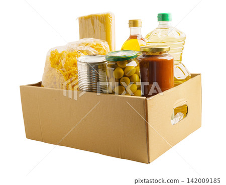 Foodstuffs in donation box for volunteer to help people. Foodstuffs in donation box for volunteer to help people. 142009185