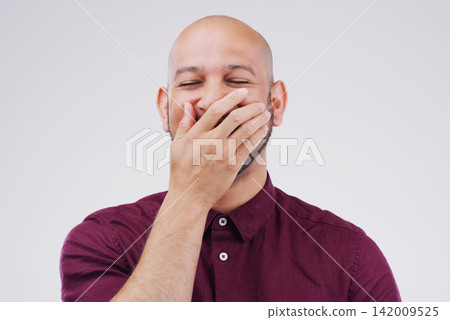 Man, cover mouth and laugh in studio for funny joke, comic and silly on gray background. Male person, happy and goofy comedy or mockup space for humor, positive and hand for satisfaction or wellness Man, cover mouth and laugh in studio for funny joke, comic and silly on gray background. Male person, happy and goofy comedy or mockup space for humor, positive and hand for satisfaction or wellness 142009525