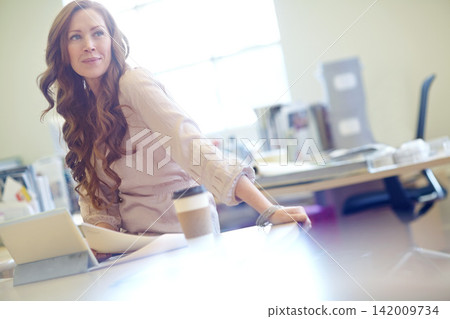 Woman, thinking and paperwork for plan at desk, tablet and online research for report in office. Female person, documents and report on budget or solution, review and insurance agent for coffee Woman, thinking and paperwork for plan at desk, tablet and online research for report in office. Female person, documents and report on budget or solution, review and insurance agent for coffee 142009734