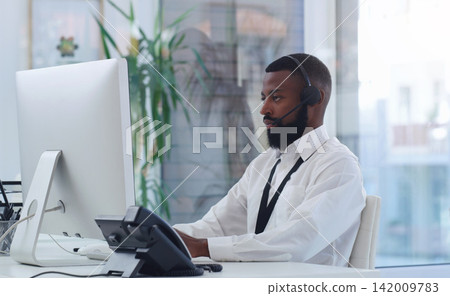 Customer service, headset and black man with computer in office for online crm consultation. Technology, telemarketing and African male technical support working on desktop for contact in workplace. Customer service, headset and black man with computer in office for online crm consultation. Technology, telemarketing and African male technical support working on desktop for contact in workplace. 142009783