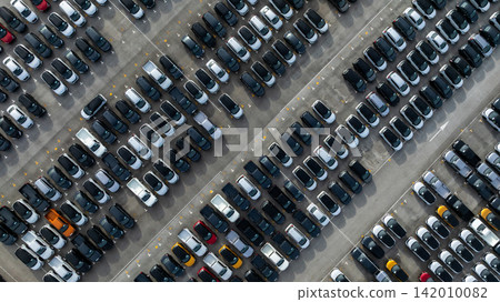 Aerial view new car lined up, Automobile automotive car parking lot commercial business industry, Port of import export business logistic dealership, New cars global business logistic import export. Aerial view new car lined up, Automobile automotive car parking lot commercial business industry, Port of import export business logistic dealership, New cars global business logistic import export. 142010082