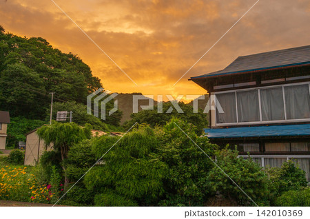 The sunset sky over Kuzumaki, a country evening. The sunset sky over Kuzumaki, a country evening. 142010369