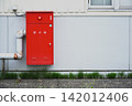 Red fire hydrant box mounted on the wall 142012406