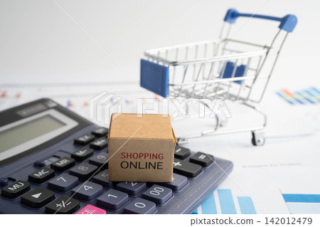 Online shopping, Shopping cart box on calculator, import export, finance commerce. Online shopping, Shopping cart box on calculator, import export, finance commerce. 142012479