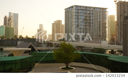 Modern urban skyline with residential buildings and green park area Modern urban skyline with residential buildings and green park area 142013234