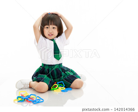 Surprised Asian Little Girl Playing Building Blocks Toy Showing Shocked Expression Isolated on White Background 142014366