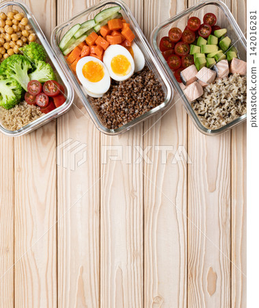 Organized meal prep boxes wooden background Organized meal prep boxes wooden background 142016281