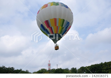 Hot air balloon floating in the sky Hot air balloon floating in the sky 142016371