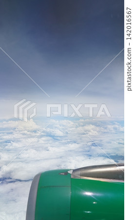 Airplane View of Clouds and Sky From Above Plane Engine Airplane View of Clouds and Sky From Above Plane Engine 142016567