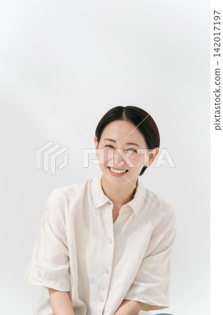 Smiling woman in her forties Smiling woman in her forties 142017197