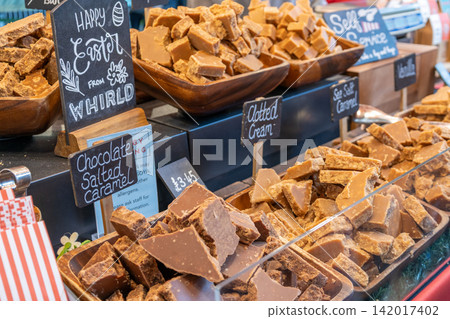Assorted handmade fudge display on a market stall Assorted handmade fudge display on a market stall 142017402