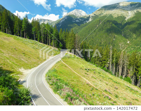 Pirin Mountains National Park Bulgaria winding asphalt road summer alpine slopes leading towards Vihren hut near Bansko Pirin Mountains National Park Bulgaria winding asphalt road summer alpine slopes leading towards Vihren hut near Bansko 142017472